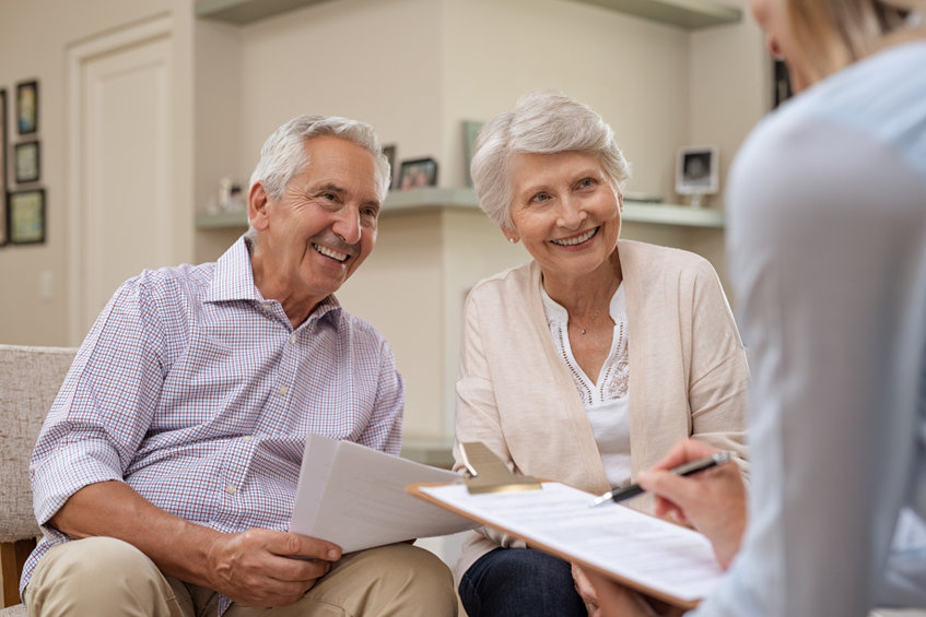 senior couple meeting financial advisor